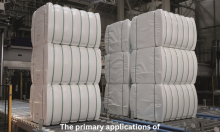 What are the primary applications of large paper rolls in the textile and packaging industries?